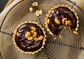 Peanut-caramel chocolate tartlets
